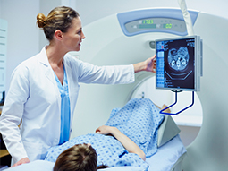 Female Doctor showing CT scan to patient
